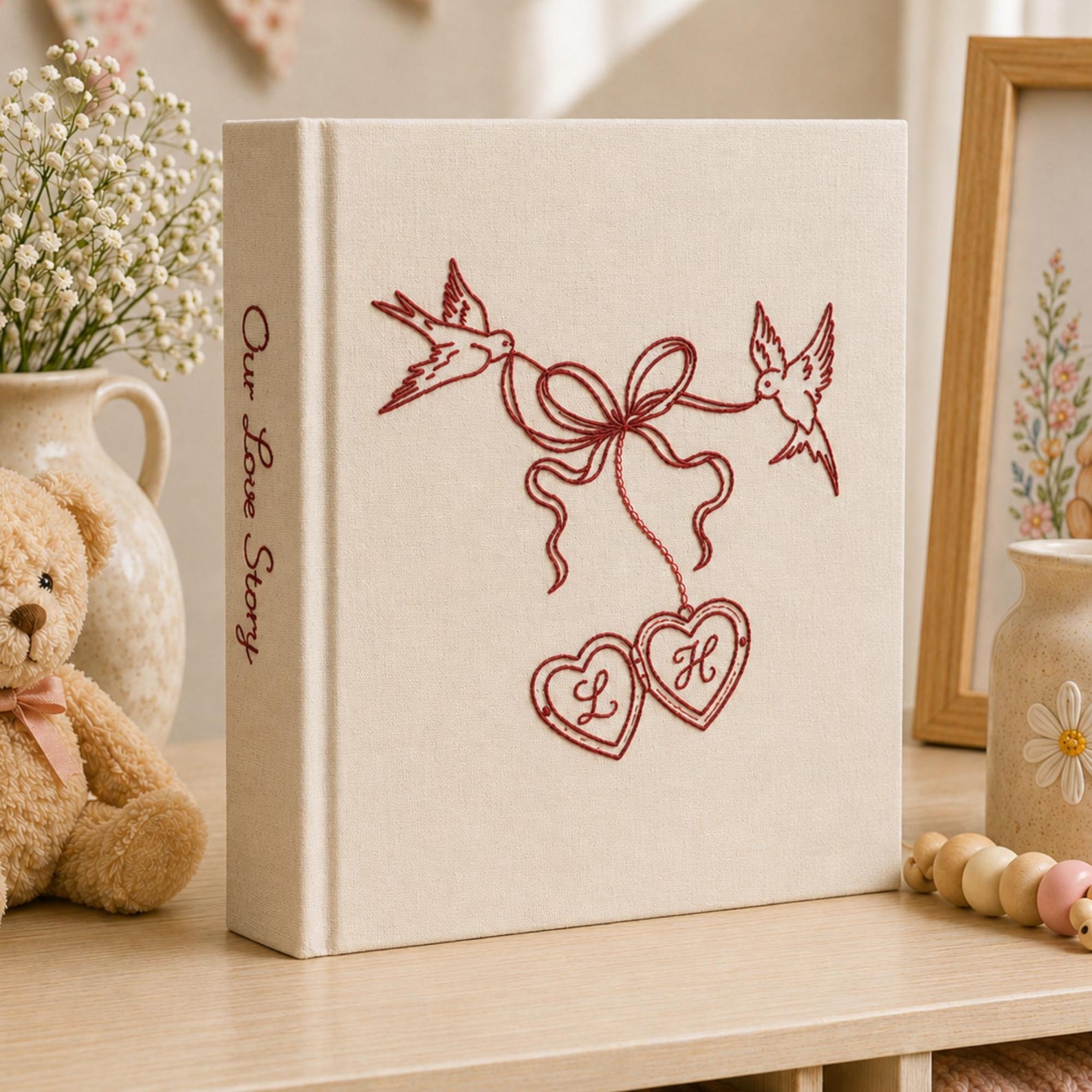 Personalized embroidered wedding photo album with minimalist birds ribbon hearts and custom initials on linen cover