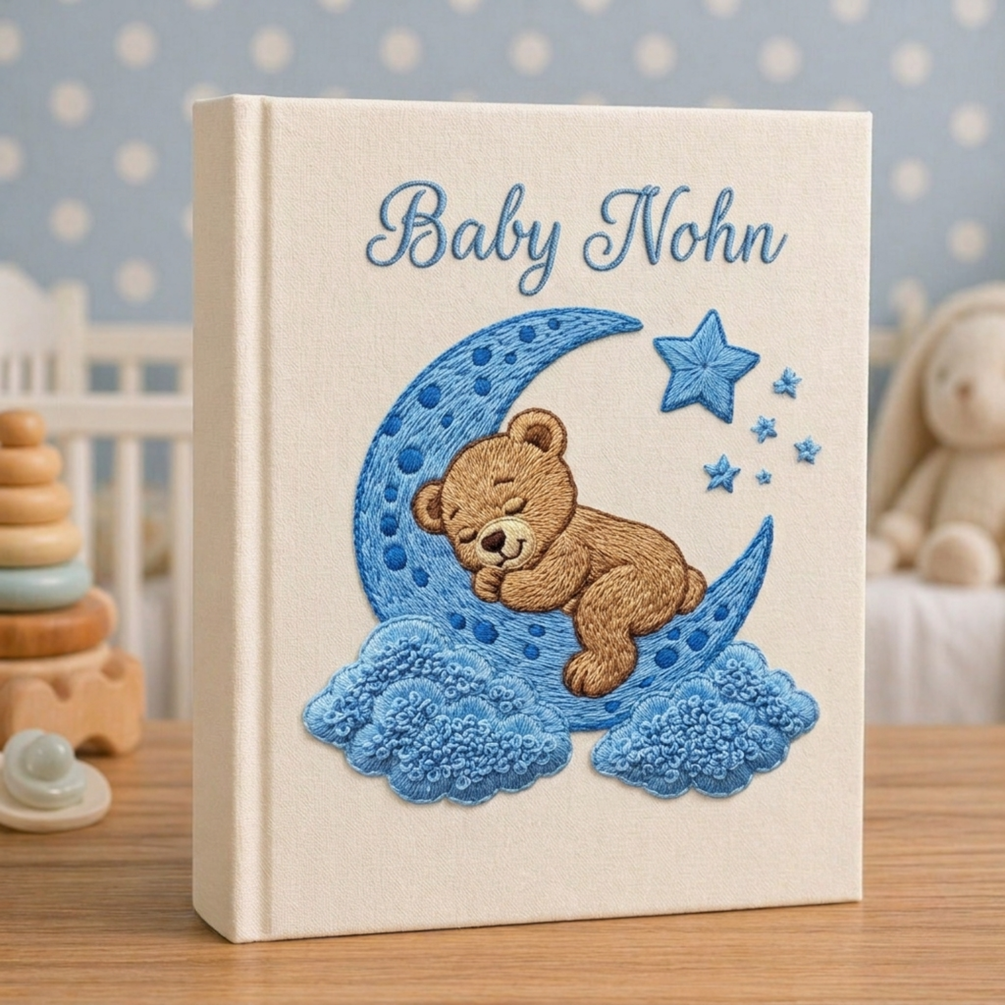 Personalized hand embroidered photo album featuring a sleeping teddy bear resting on a fluffy cloud in a dreamy nursery theme