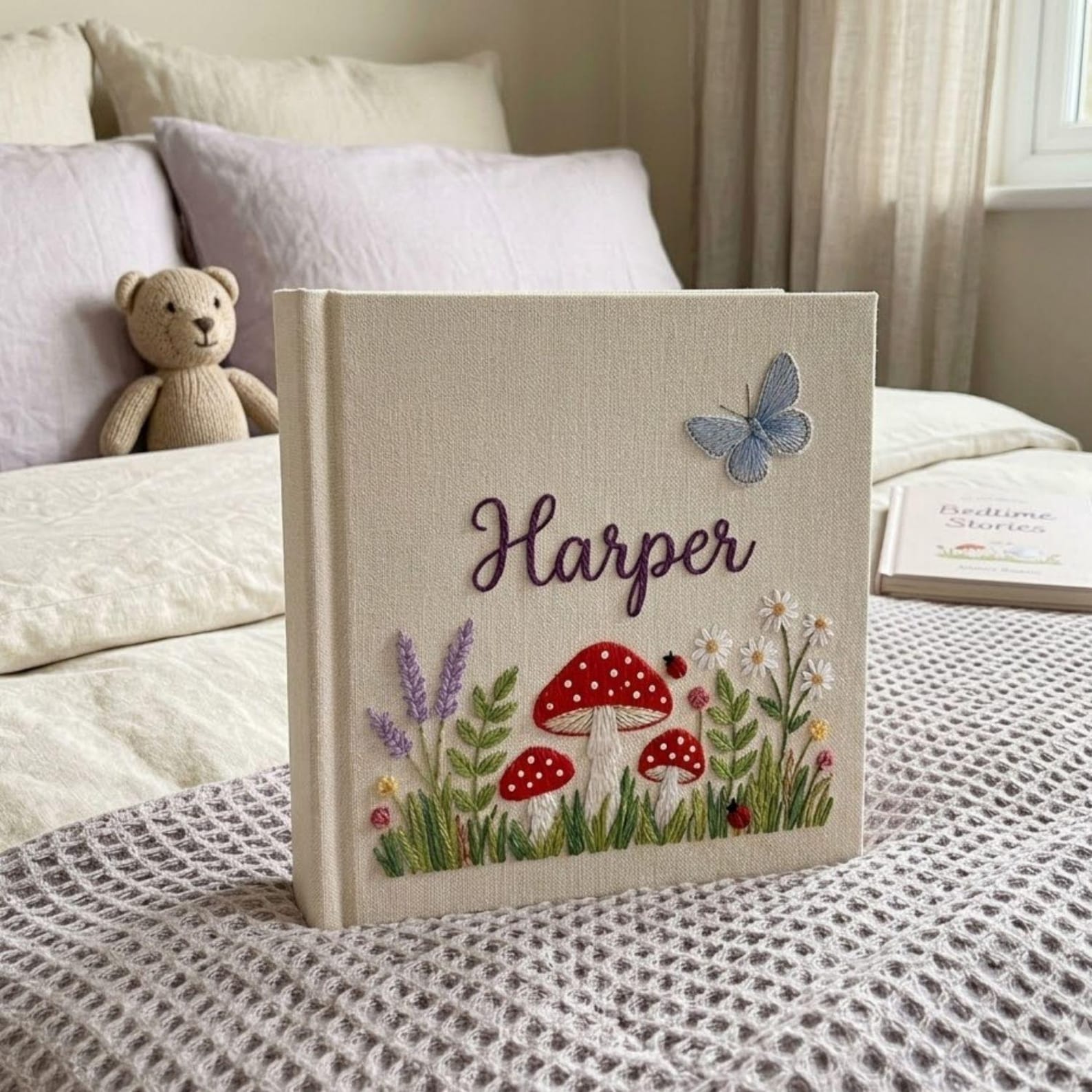 Personalized woodland mushroom embroidered baby photo album with whimsical forest design on linen cover
