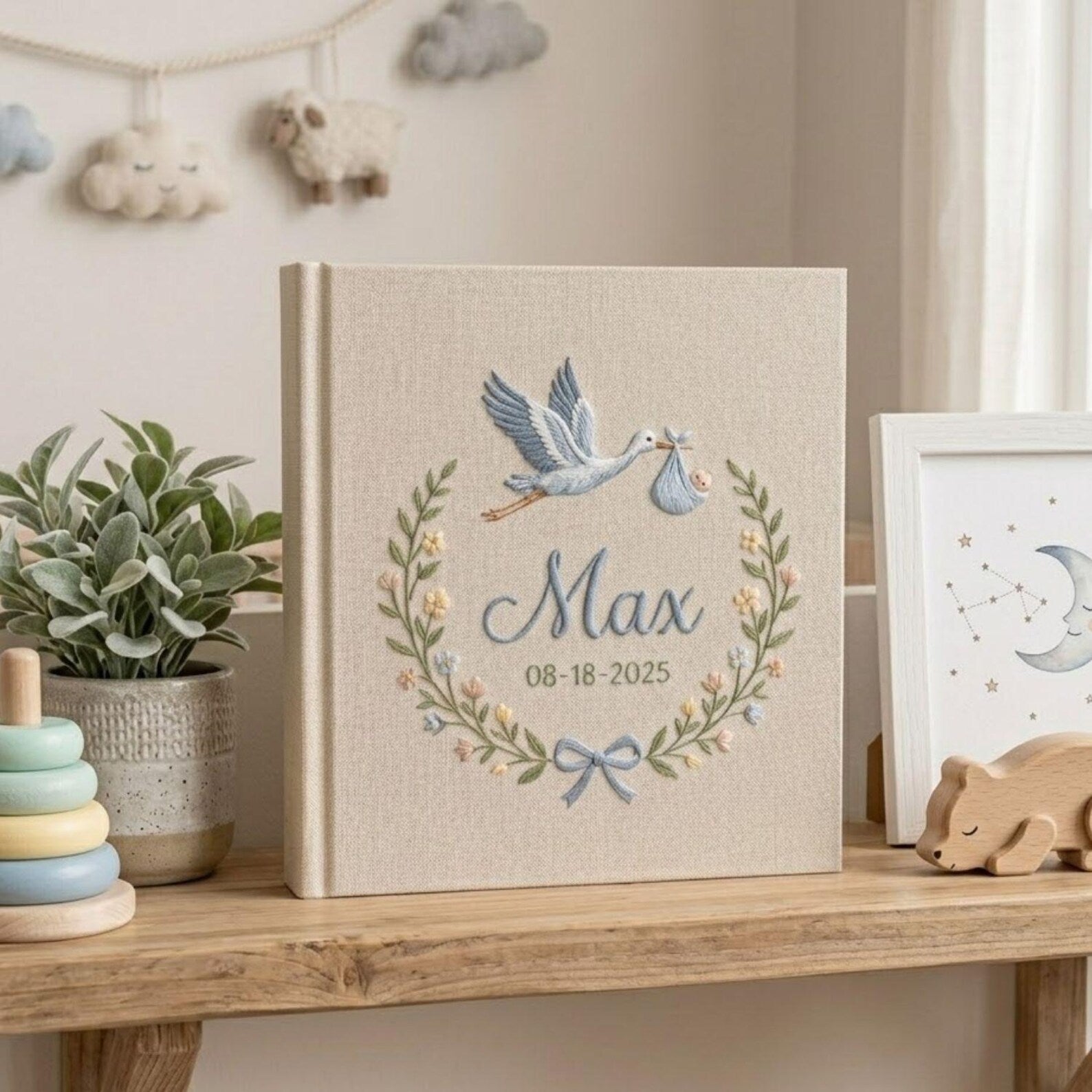 Personalized stork birth announcement embroidered baby photo album with custom name and birth date on linen cover