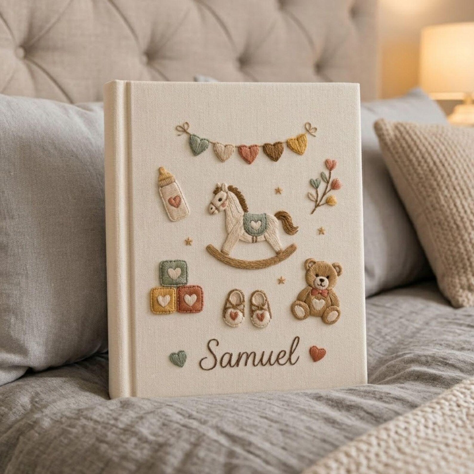 Personalized baby toys hand embroidered photo album with rocking horse teddy bear and nursery accessories on linen cover