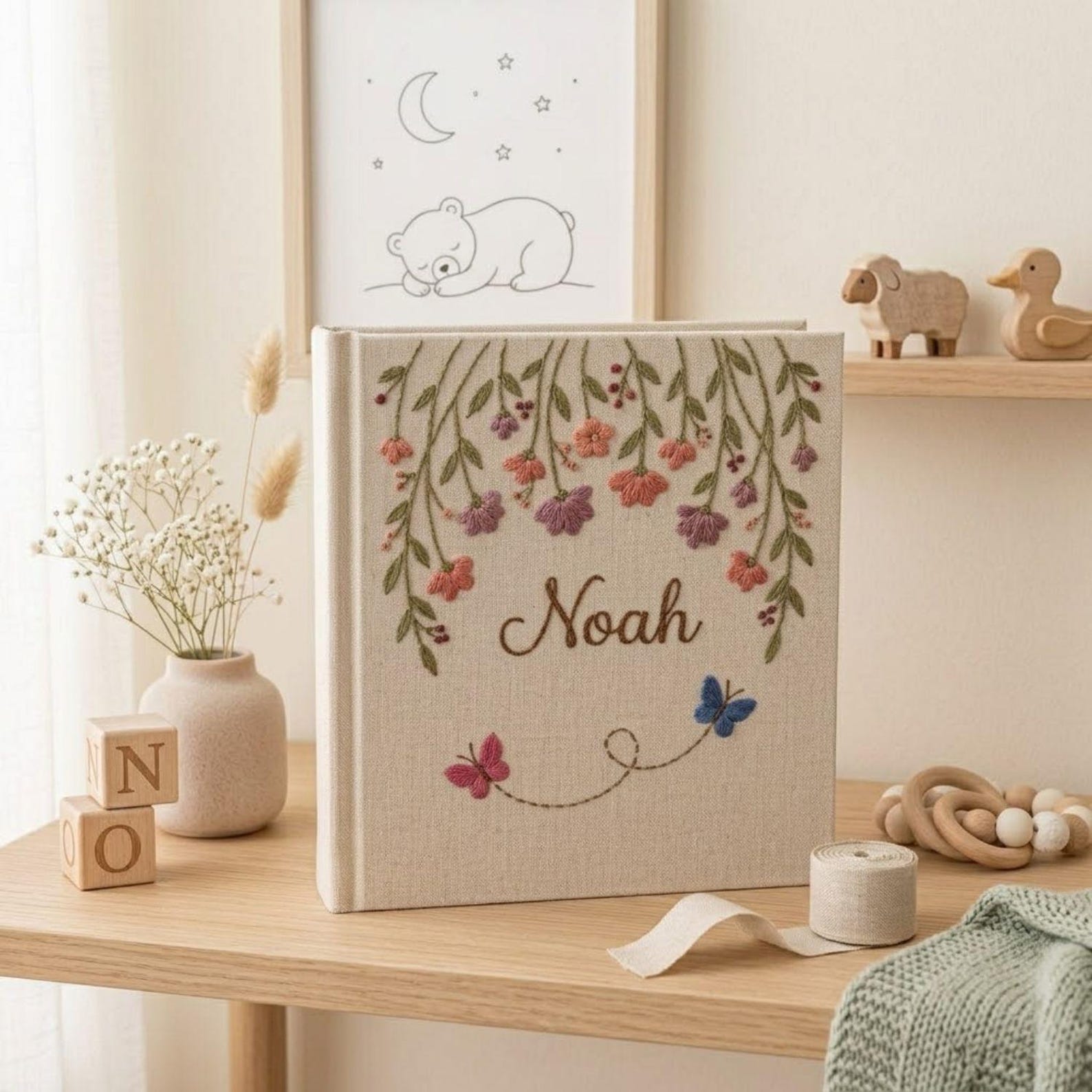 Personalized hanging floral butterfly hand embroidered baby photo album with botanical flower design on linen cover