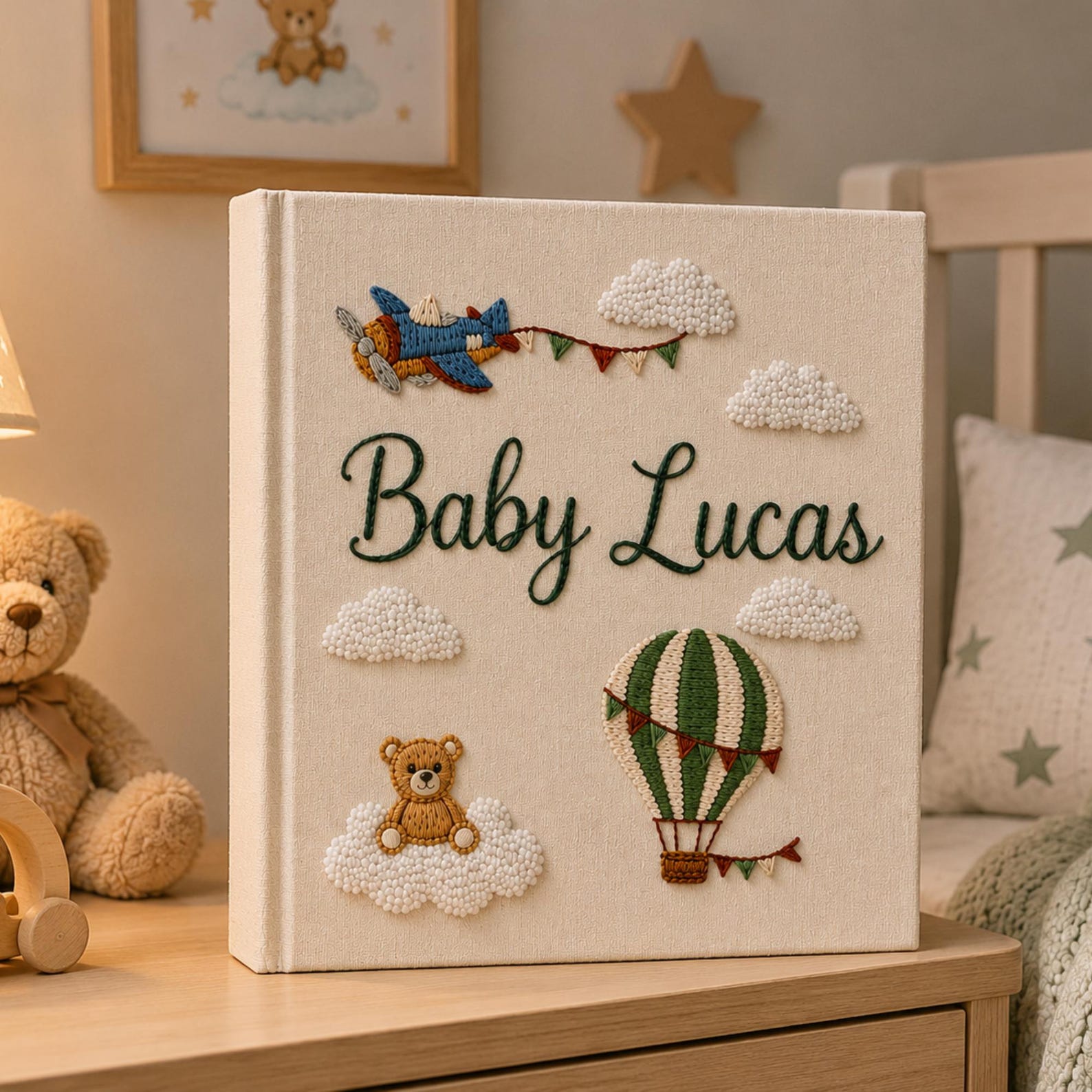 Personalized hand embroidered baby photo album with hot air balloon, airplane, clouds, and teddy bear embroidery