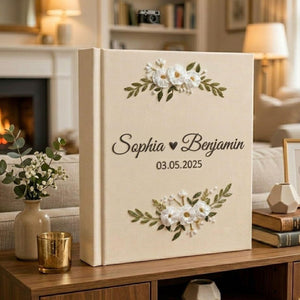 Personalized hand embroidered wedding photo album with white floral embroidery custom names and wedding date on linen cover