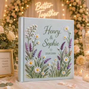 Collection of personalized hand embroidered floral wedding photo albums with botanical embroidery, custom couple names, and romantic linen covers