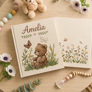 Personalized embroidered baby photo album with woodland teddy bear, butterflies, and greenery design