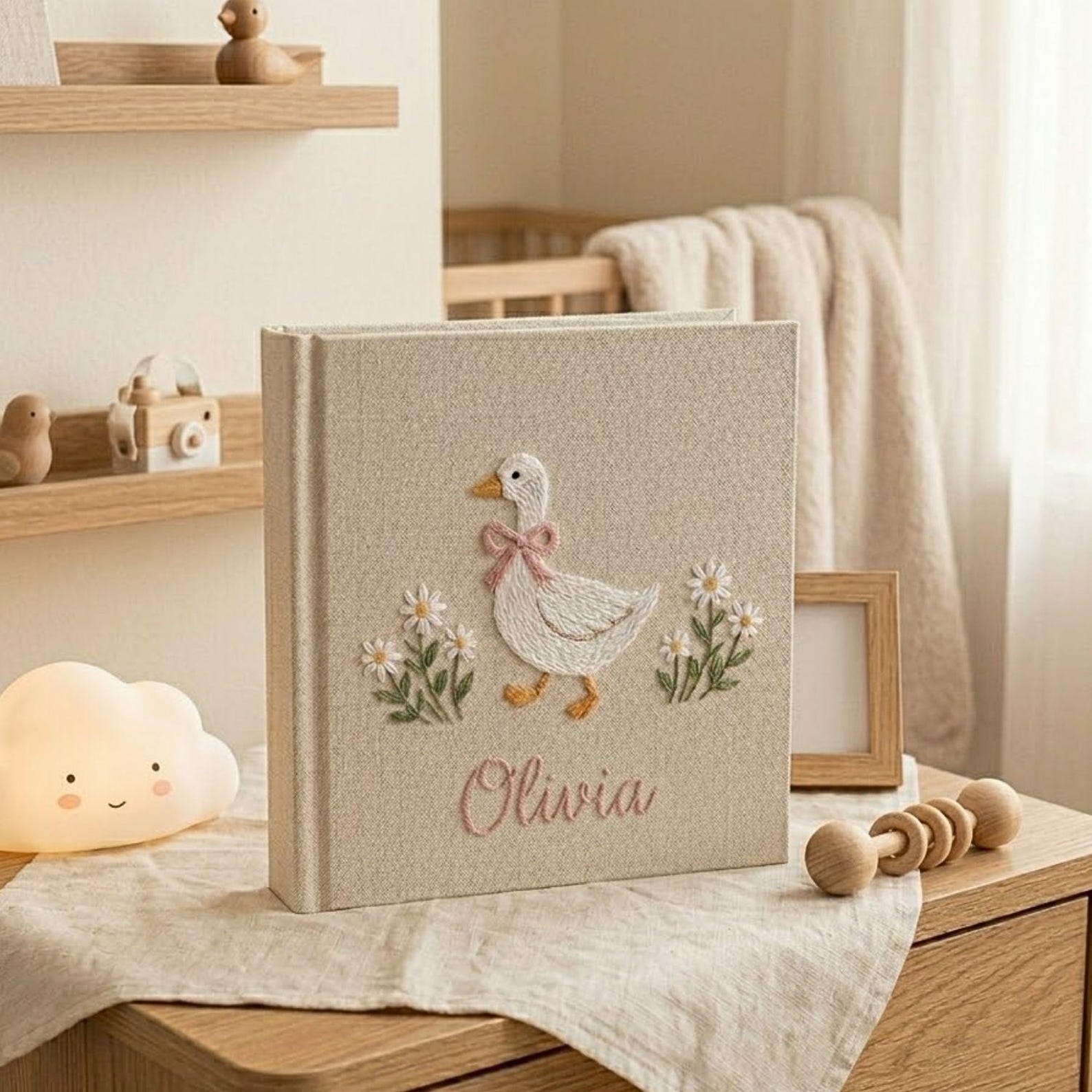 Personalized goose hand embroidered baby photo album with daisy floral cottagecore nursery design on linen cover