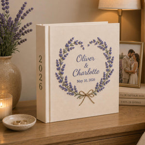 Personalized lavender embroidered wedding photo album with custom names, wedding date, floral wreath embroidery, and linen hardcover design