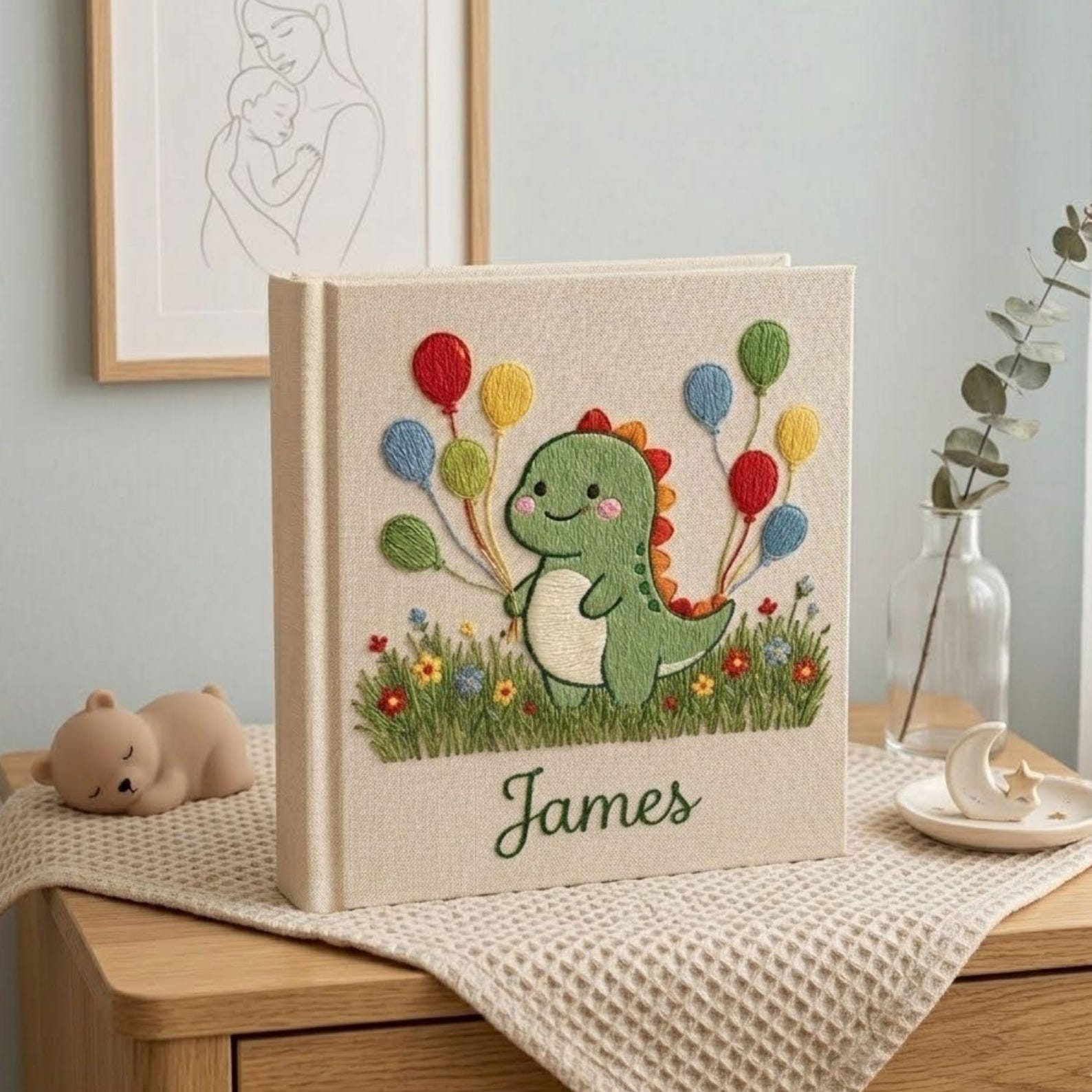 Personalized dinosaur hand embroidered baby photo album with colorful balloons and custom name on linen cover