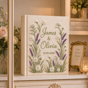 Personalized hand embroidered daisy lavender wedding photo album with botanical floral embroidery and custom names on linen cover