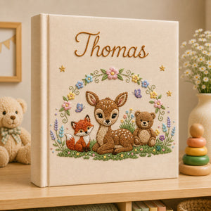 Personalized hand embroidered photo album featuring a woodland fawn fox and teddy bear surrounded by flowers and butterflies on a premium linen cover customized with a baby name