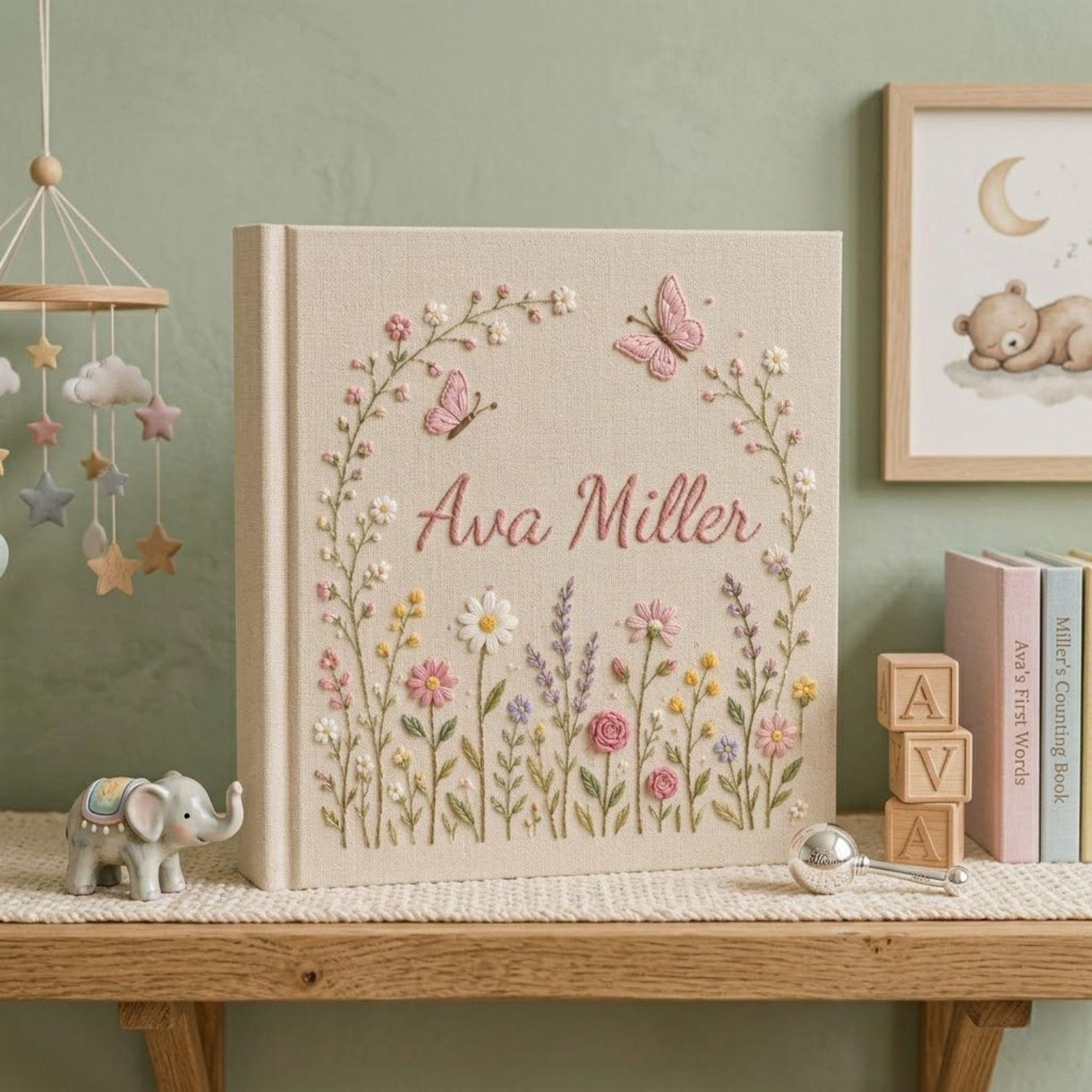 Personalized hand embroidered photo album featuring pastel wildflowers butterflies and custom name embroidery on linen cover