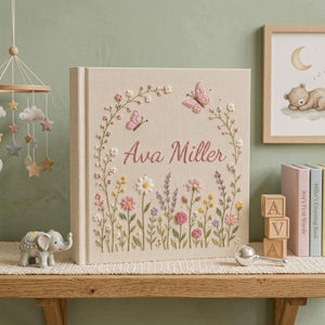 Personalized hand embroidered photo album featuring pastel wildflowers butterflies and custom name embroidery on linen cover