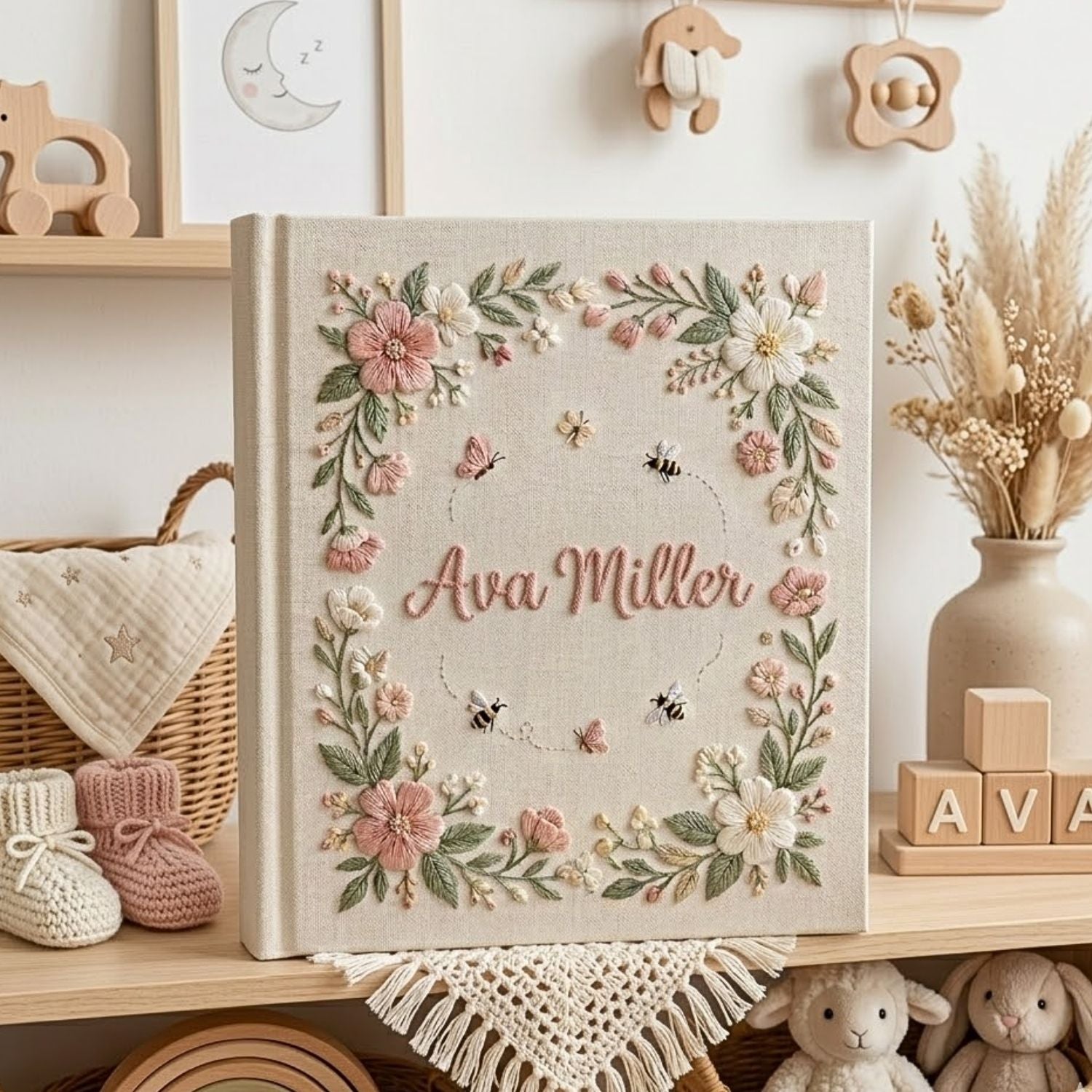 Personalized hand embroidered photo album featuring a floral garden wreath with bees, butterflies, delicate flowers and custom embroidered name on linen cover