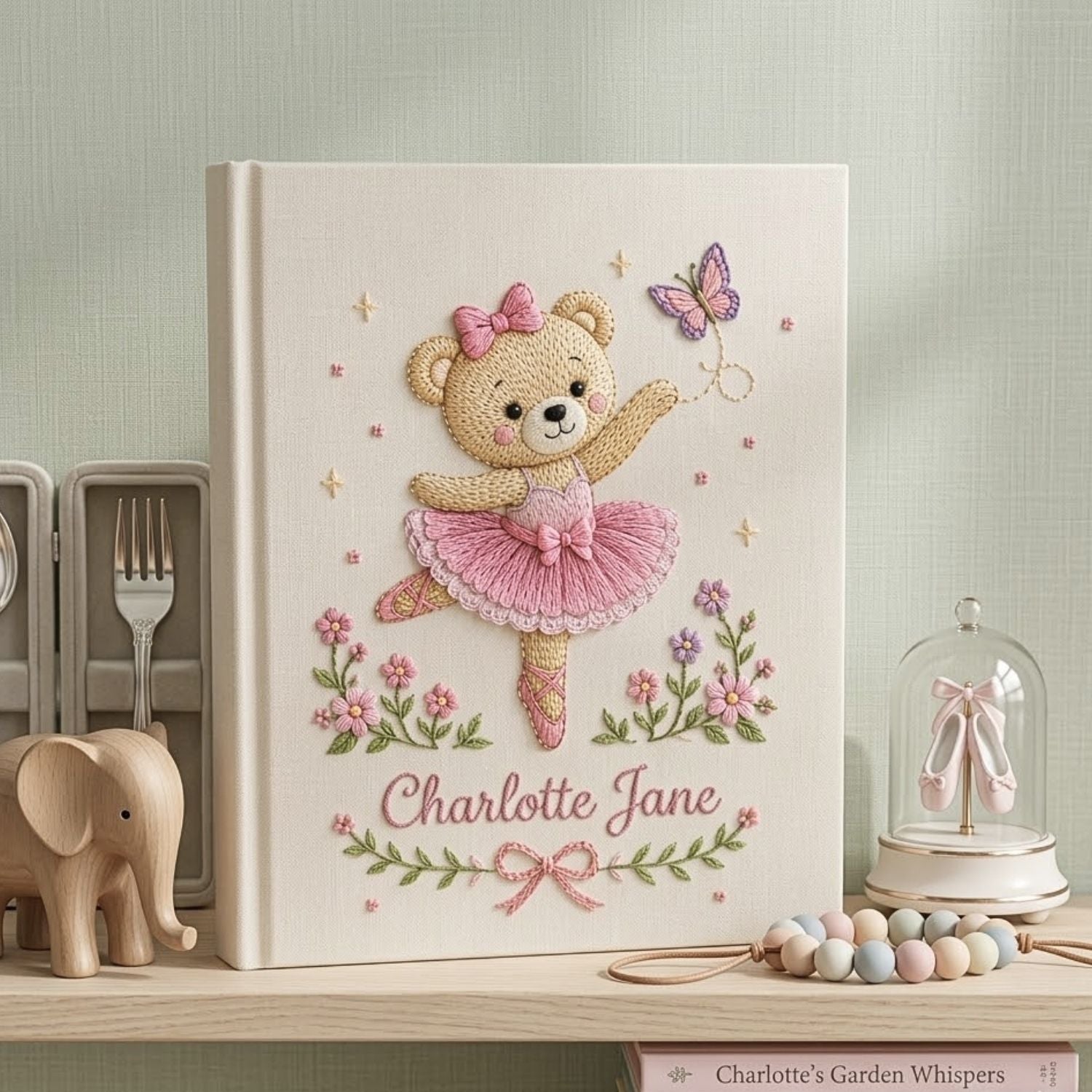 Personalized hand embroidered photo album featuring a ballerina teddy bear in a pink tutu dancing with a butterfly and floral accents