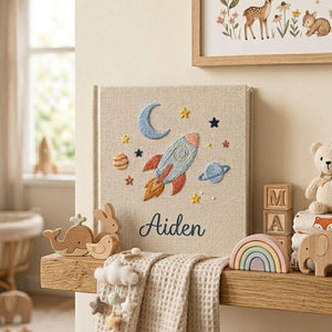 Personalized embroidered baby photo album with space rocket, moon, planets, stars, and custom name embroidery