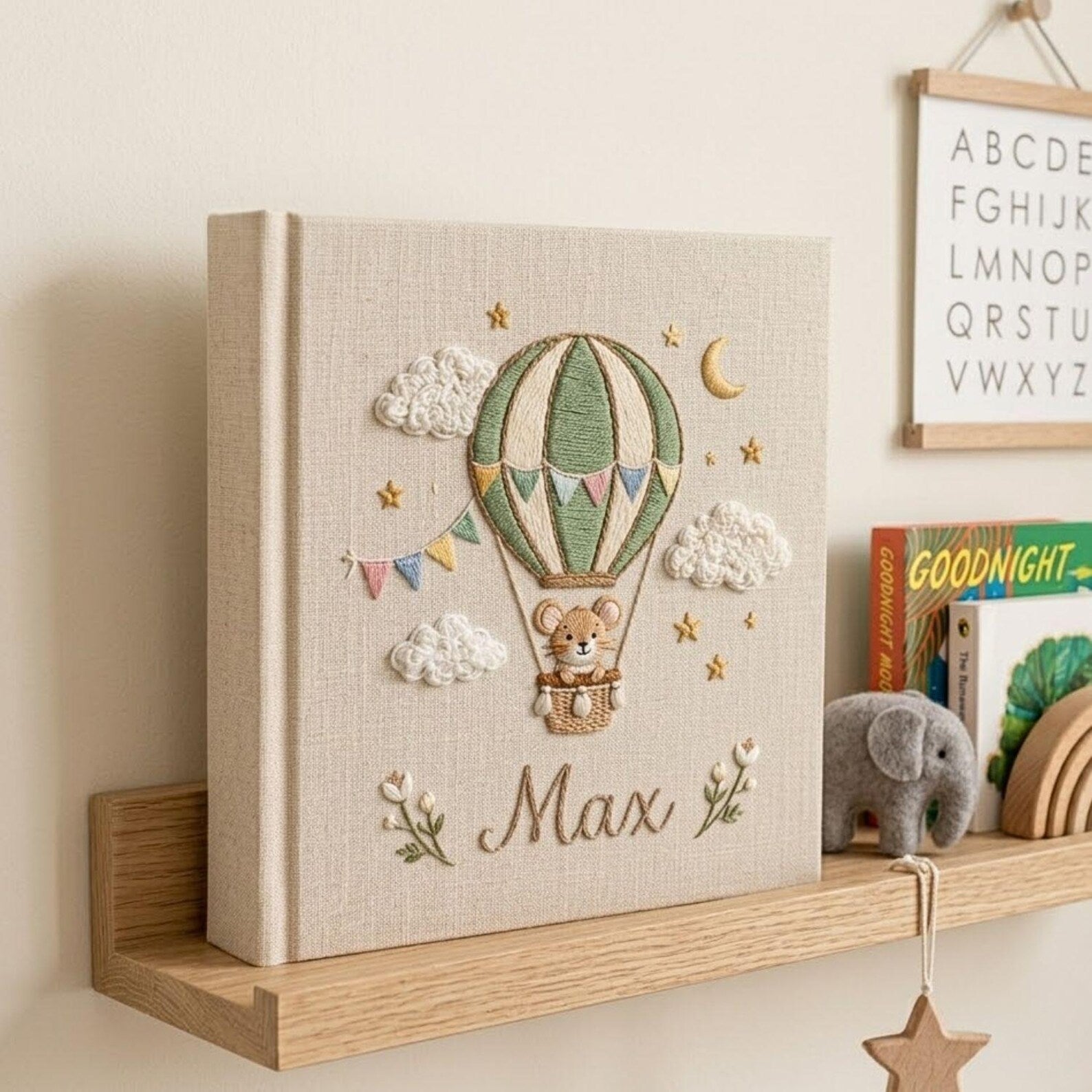 Personalized mouse hot air balloon embroidered baby photo album with whimsical nursery design on linen cover