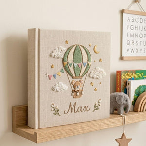 Personalized mouse hot air balloon embroidered baby photo album with whimsical nursery design on linen cover