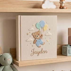 Personalized teddy balloon hand embroidered baby photo album with pastel nursery design on linen cover