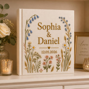 Personalized hand embroidered wildflower wedding photo album with botanical floral design and custom names on linen cover