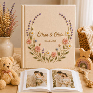 Personalized embroidered wedding photo album with lavender stems pastel daisies and custom couple names on linen cover