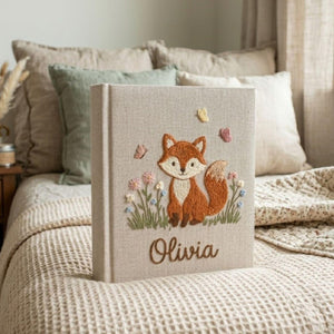 Personalized woodland fox hand embroidered baby photo album with floral butterfly design on linen cover