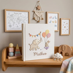 Personalized embroidered baby photo album with elephant, bunny, pastel balloons, and custom name embroidery