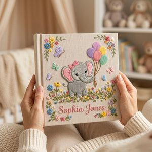 Personalized hand embroidered photo album featuring cute elephant holding colorful balloons surrounded by flowers butterflies and custom name embroidery