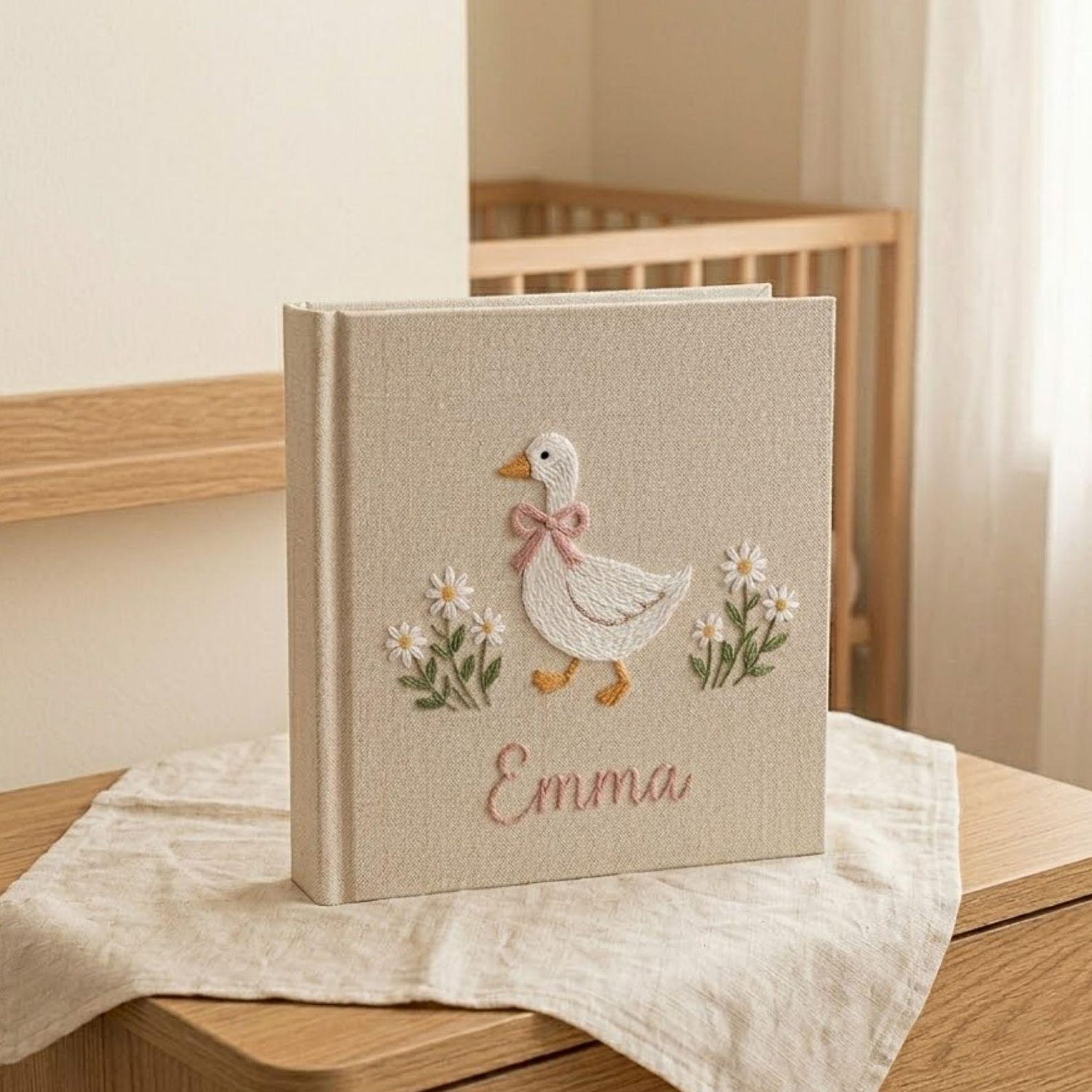 Personalized goose hand embroidered baby photo album with daisy floral cottagecore nursery design on linen cover