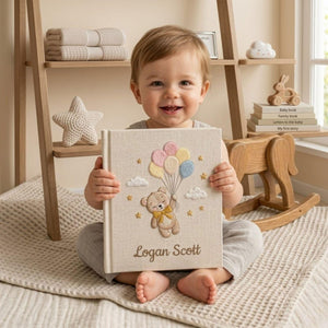 Personalized hand embroidered photo album featuring a floating teddy bear holding pastel balloons with custom baby name embroidery