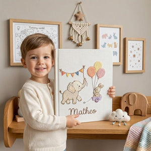 Personalized embroidered baby photo album with elephant, bunny, pastel balloons, and custom name embroidery