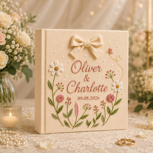 Personalized hand embroidered floral wedding photo album with bow detail and custom couple names on linen cover