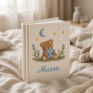 Personalized sleepy teddy hand embroidered baby photo album with moon star and bedtime nursery design on linen cover