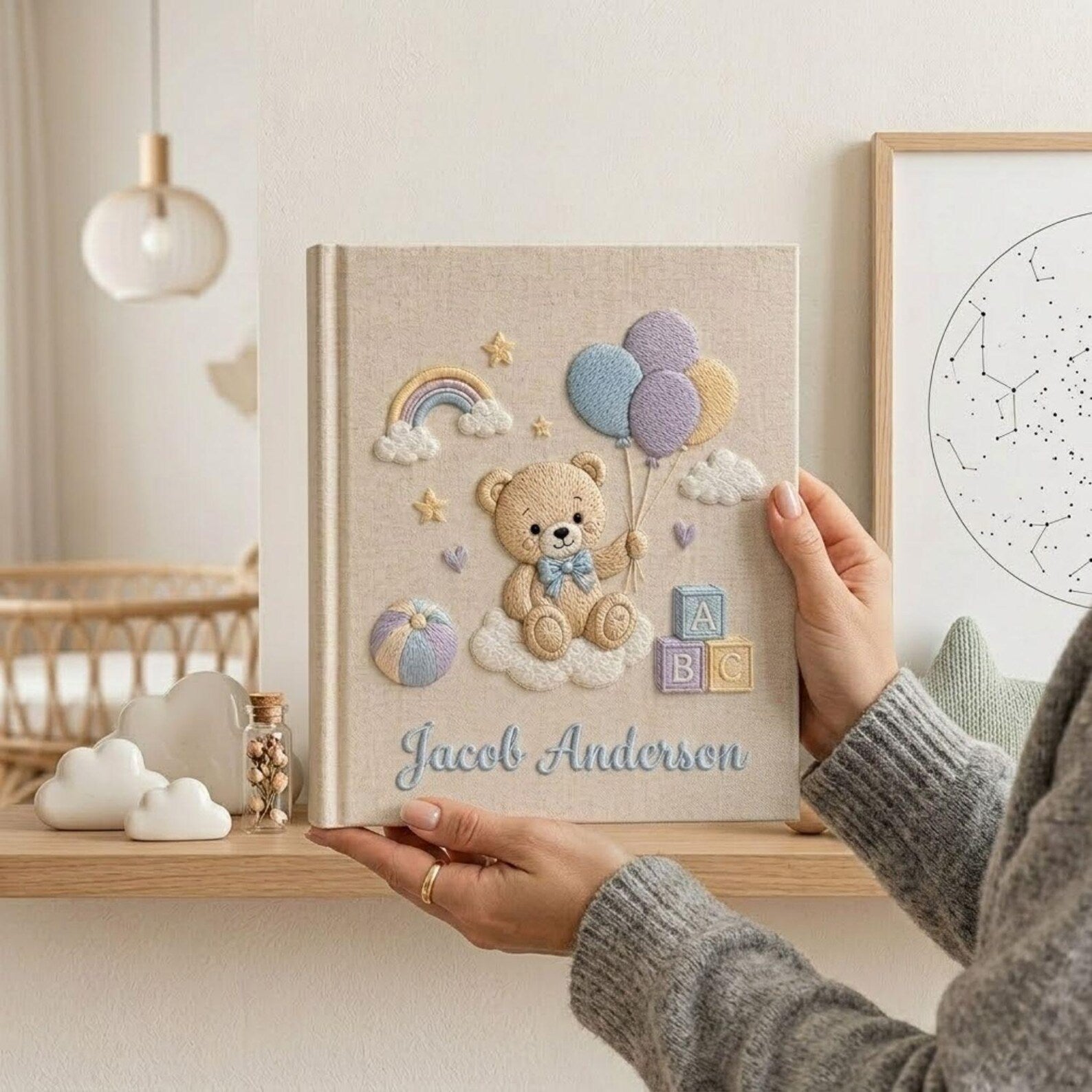 Personalized hand embroidered photo album featuring teddy bear holding pastel balloons with rainbow clouds ABC blocks and custom baby name