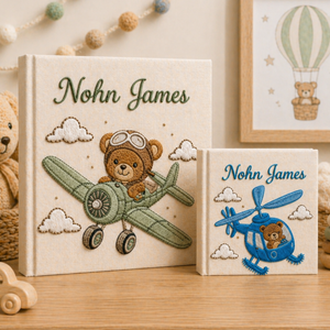 Personalized hand embroidered photo album featuring an aviator teddy bear flying a vintage airplane through fluffy clouds with custom name embroidery