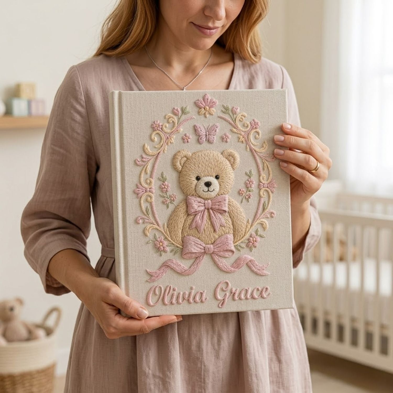 Personalized hand embroidered photo album featuring a vintage teddy bear surrounded by a floral wreath, pink bows and delicate butterfly accents