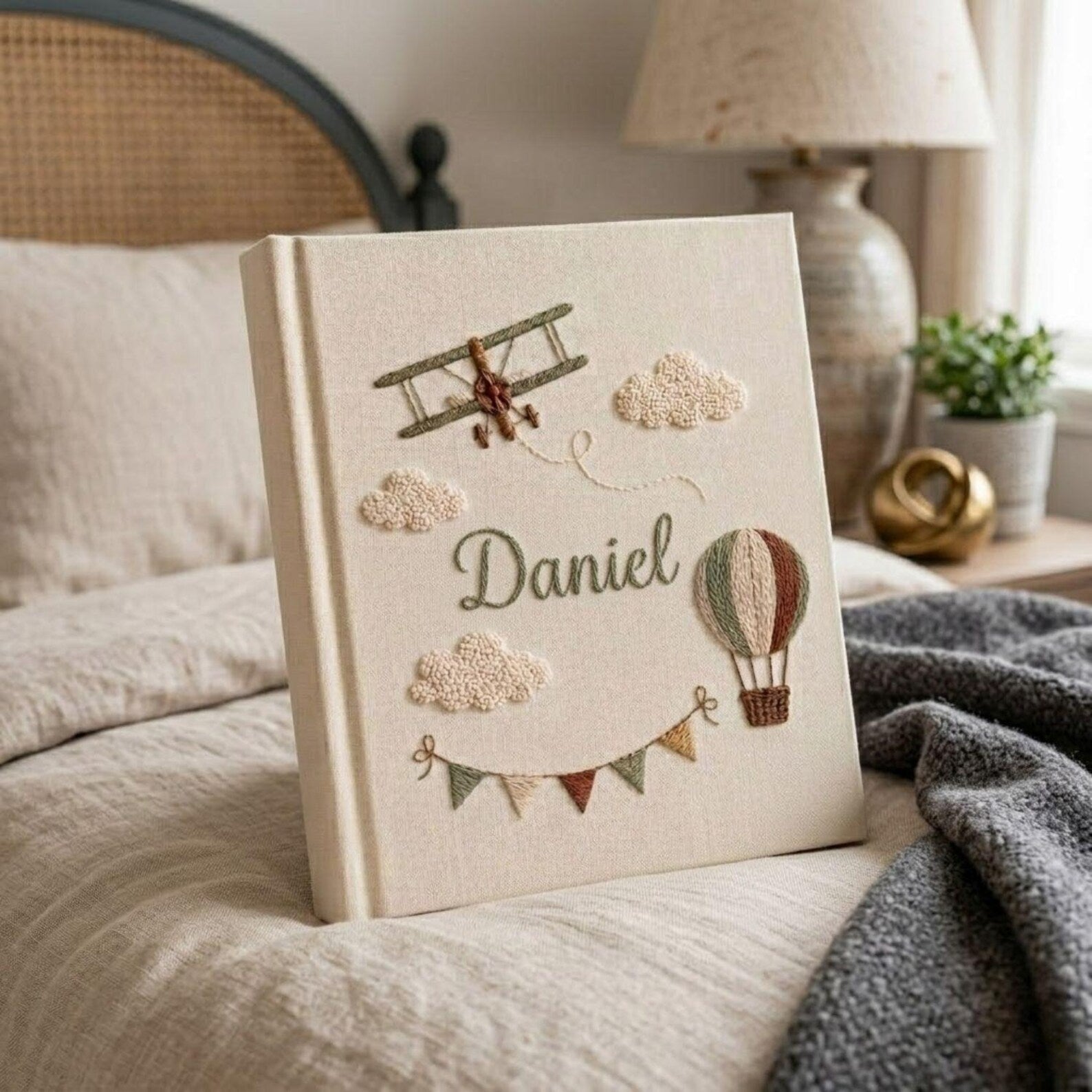 Personalized adventure hand embroidered baby photo album with airplane hot air balloon and cloud design on linen cover