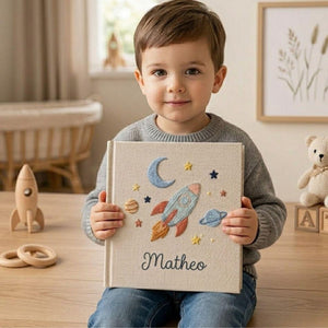 Personalized embroidered baby photo album with space rocket, moon, planets, stars, and custom name embroidery