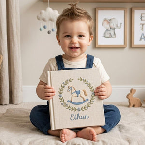 Personalized hand embroidered baby photo album with rocking horse and botanical wreath nursery design
