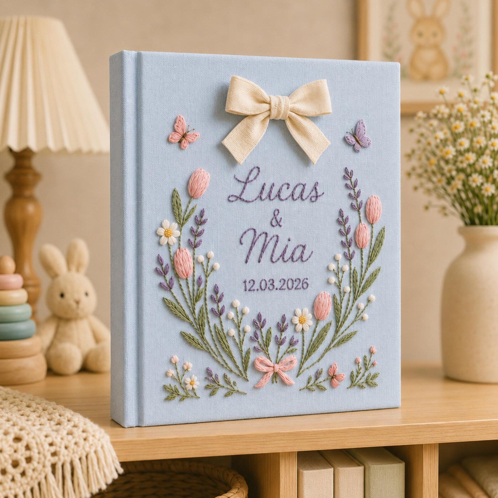 Personalized hand embroidered tulip floral wedding photo album with bow detail and custom couple names on linen cover