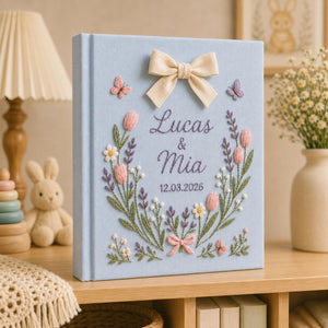 Personalized hand embroidered tulip floral wedding photo album with bow detail and custom couple names on linen cover