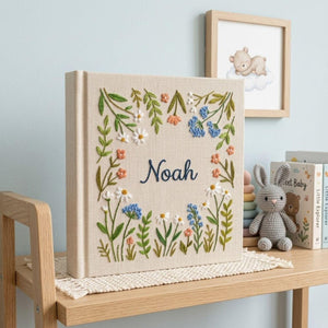 Personalized wildflower garden hand embroidered baby photo album with botanical floral meadow design on linen cover