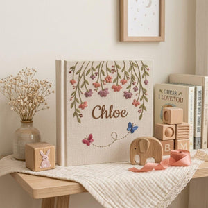 Personalized hanging floral butterfly hand embroidered baby photo album with botanical flower design on linen cover
