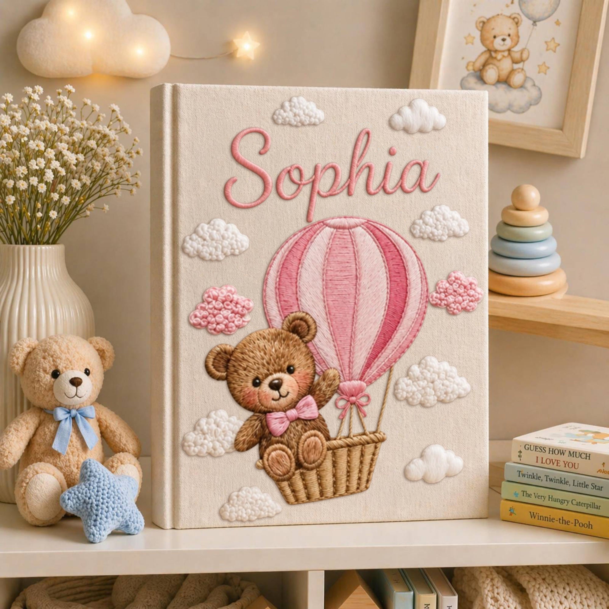 Personalized hand embroidered baby photo album with teddy bear in pink hot air balloon and fluffy embroidered clouds