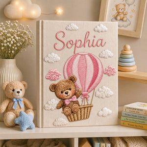 Personalized hand embroidered baby photo album with teddy bear in pink hot air balloon and fluffy embroidered clouds