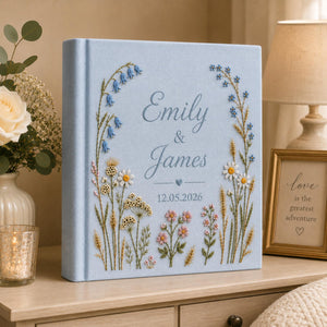 Personalized hand embroidered wildflower wedding photo album with botanical floral design and custom names on linen cover