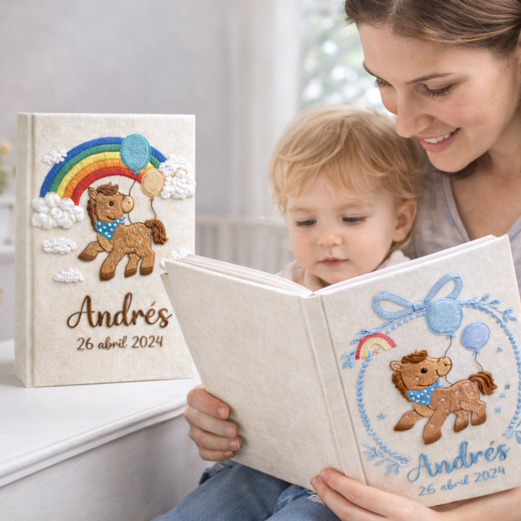 Personalized hand embroidered photo album featuring an adorable pony with balloons, colorful rainbow, fluffy clouds, and custom name embroidery on linen cover