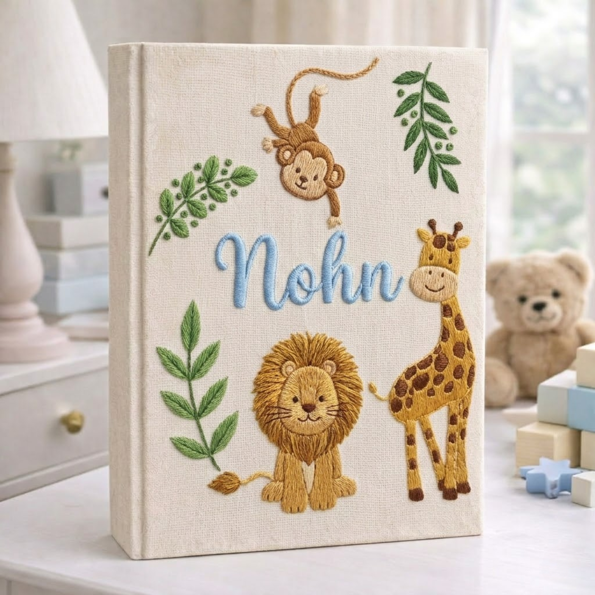 Personalized hand embroidered photo album featuring safari animals and custom birth statistics including weight, length, and birth time