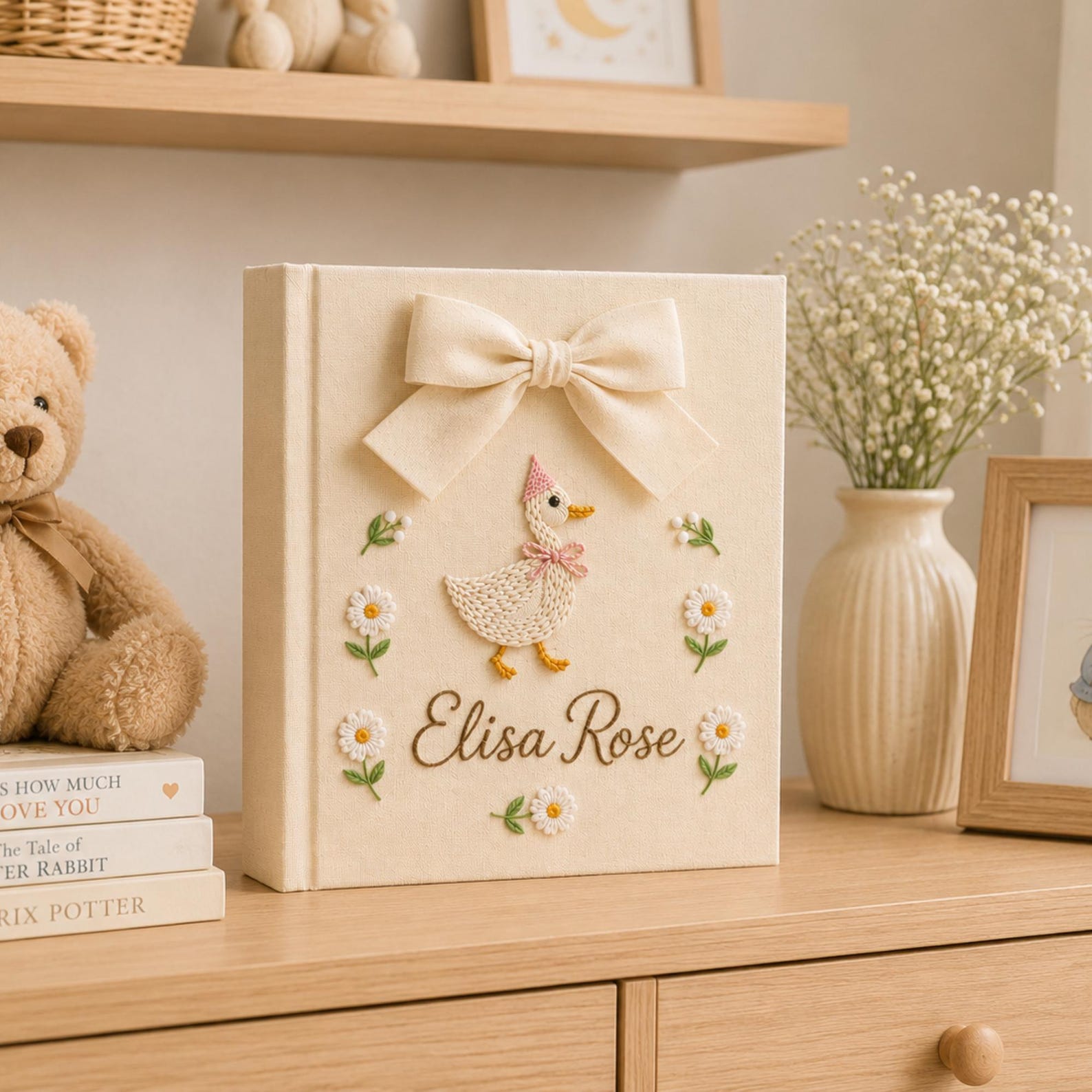 Personalized yellow hand embroidered baby photo album with duckling, daisies, and decorative bow