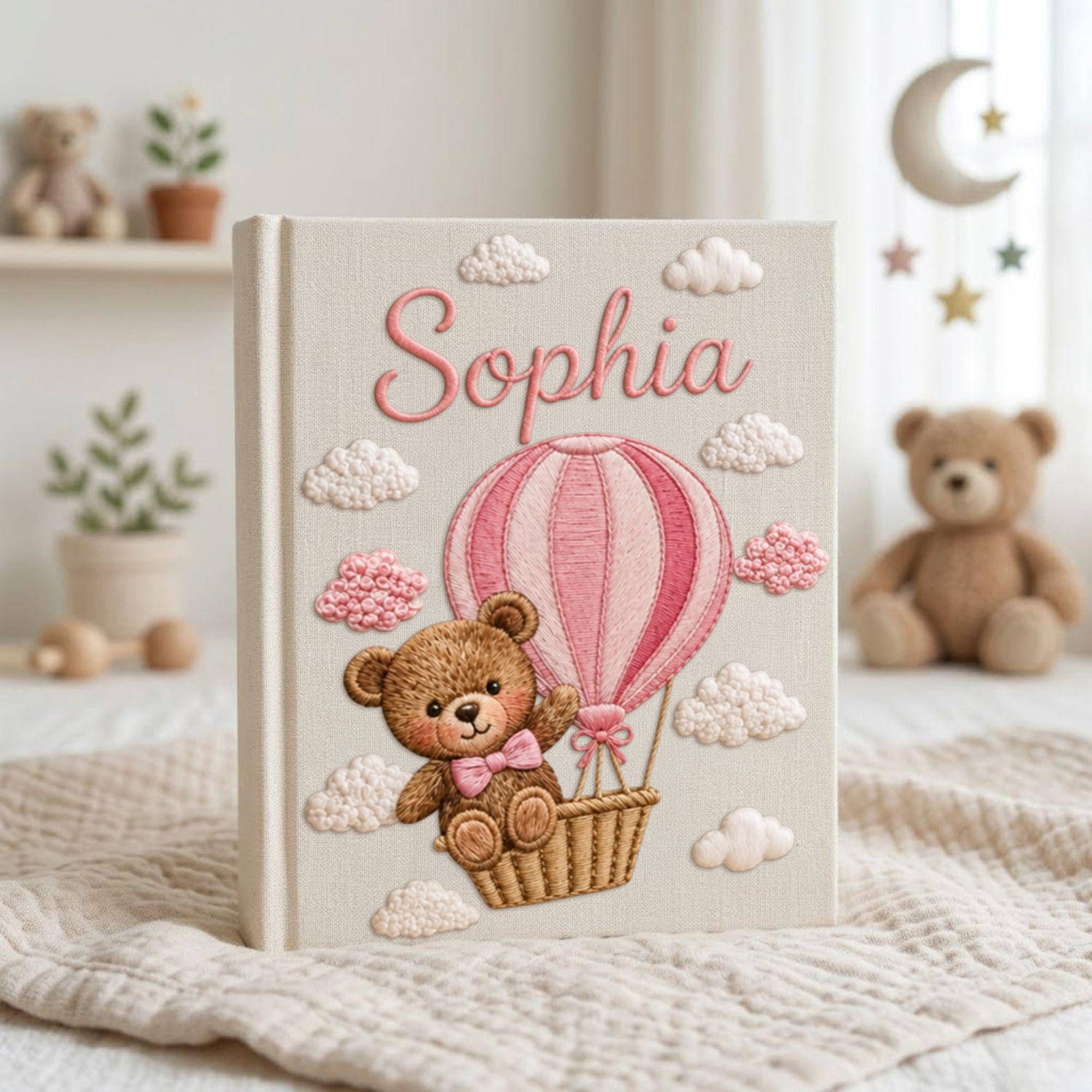 Personalized hand embroidered baby photo album with teddy bear in pink hot air balloon and fluffy embroidered clouds